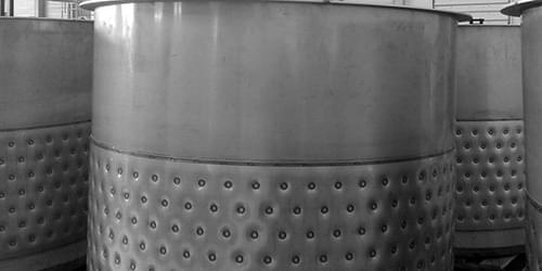 Stainless process vessel with an embossed heat transfer jacket